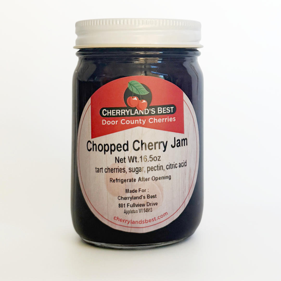 A jar of Cherryland's Best Chopped Cherry Jam with a white lid and a white label featuring a red top section, photographed on a clean white background.